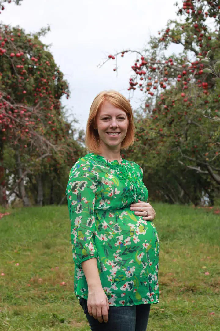 pregnant woman in green blouse